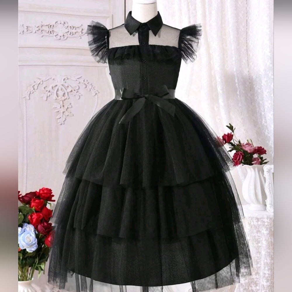Wednesday black dress and It(hand)